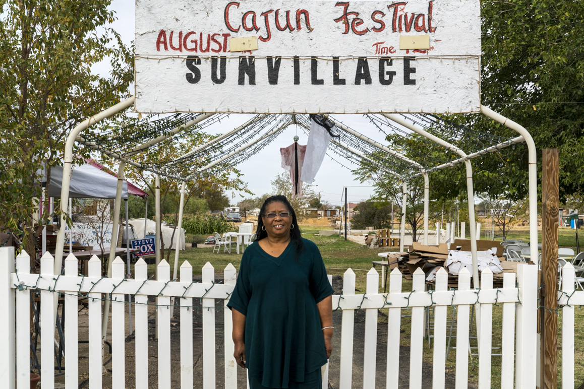 Sun Village’s mayor, Magdalene Lawrence, at her home that alternatively serves as a community gathering space. It is also the site of a former historic African American church. 