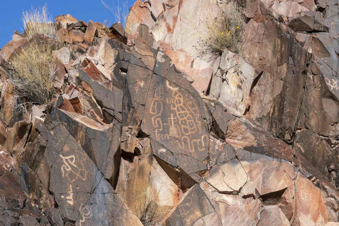 Matt Leivas, Sr., interprets this ancient petroglyph as the map of the Lake Havasu region pre-contact. Photo: Kim Stringfellow.