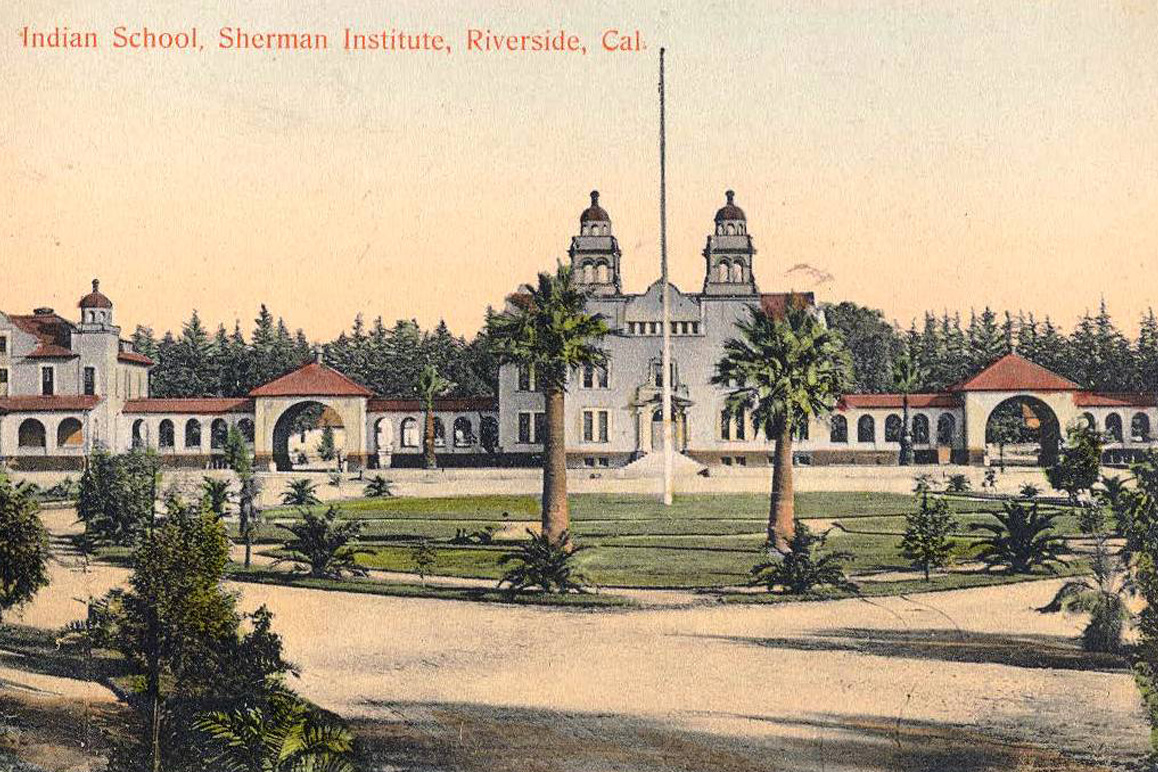 A vintage postcard showing the Mission Revival architecturally styled Sherman Institute, Riverside, CA. Credit: Sherman Indian Museum.