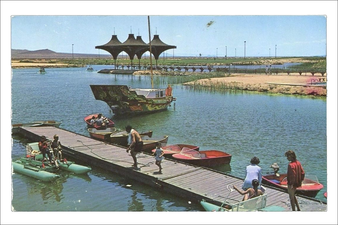 A vintage postcard showing California City's newly constructed man-made lake with the signature geometric “parasol” architectural flourishes on the pavilion that were incorporated in other city-designed structures.