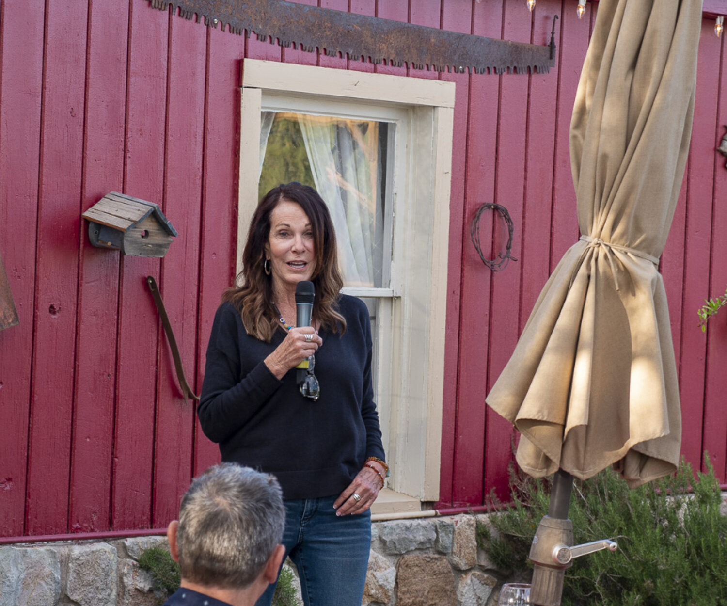 Susan Sorrells addresses the attendees during the Friday evening sponsor dinner at the Crowbar.